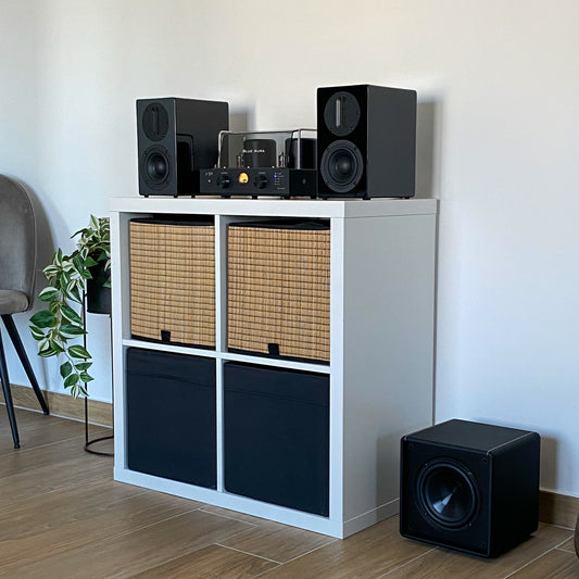 Blue Aura v50 and AT700 black speakers custom setup with X-Sub subwoofer on the floor.