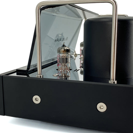 Official studio macro close-up view of the Blue Aura v50 hybrid amplifier, showcasing a precision JJ Electronic ECC83 vacuum tube behind the amplifier's transparent protective plexiglas tube guard.