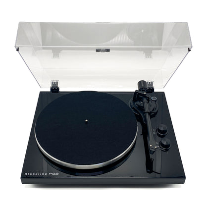 High-angle front studio view of the Blue Aura Blackline PG2 Hi-Fi turntable, showcasing the stunning mirror-like reflection on its high-gloss black plinth with the clear dust cover opened.