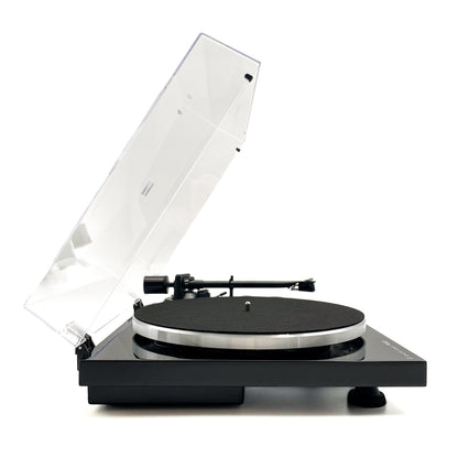 Side profile studio view of the Blue Aura Blackline PG2 Hi-Fi turntable, showcasing its high-gloss black plinth and straight tonearm with the clear dust cover fully opened.