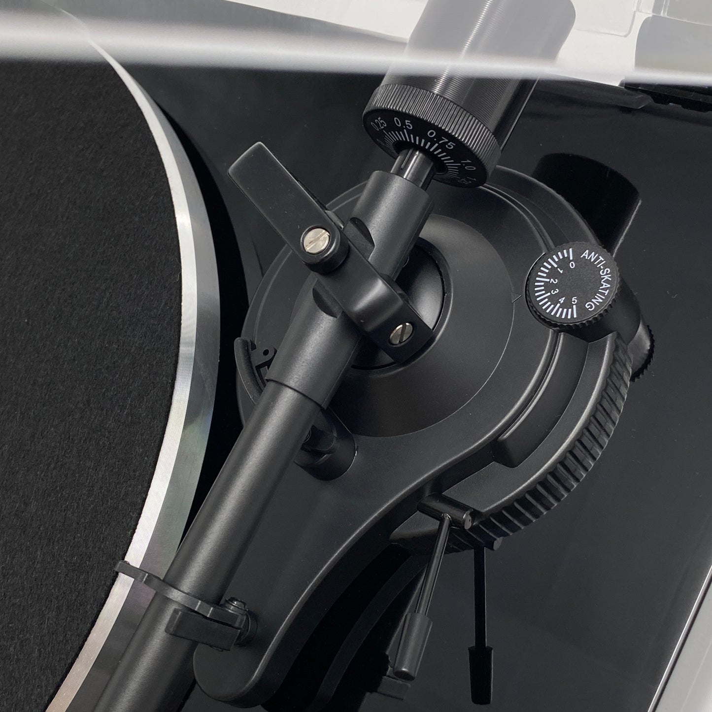 Macro studio close-up of the Blue Aura Blackline PG2 turntable tonearm base, showcasing the precision pivot assembly and anti-skating control.