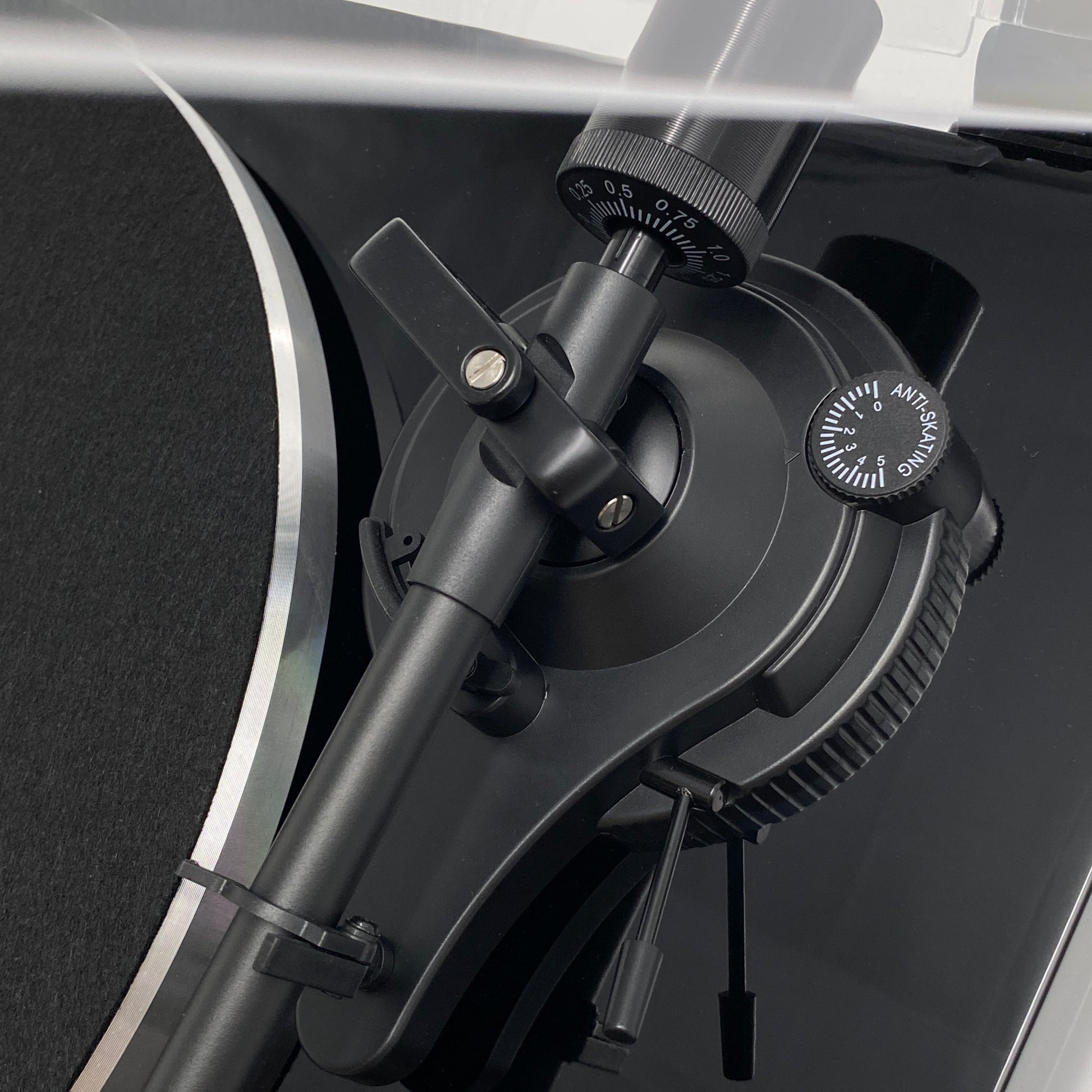 Macro studio close-up of the Blue Aura Blackline PG2 turntable tonearm base, showcasing the precision pivot assembly and anti-skating control.
