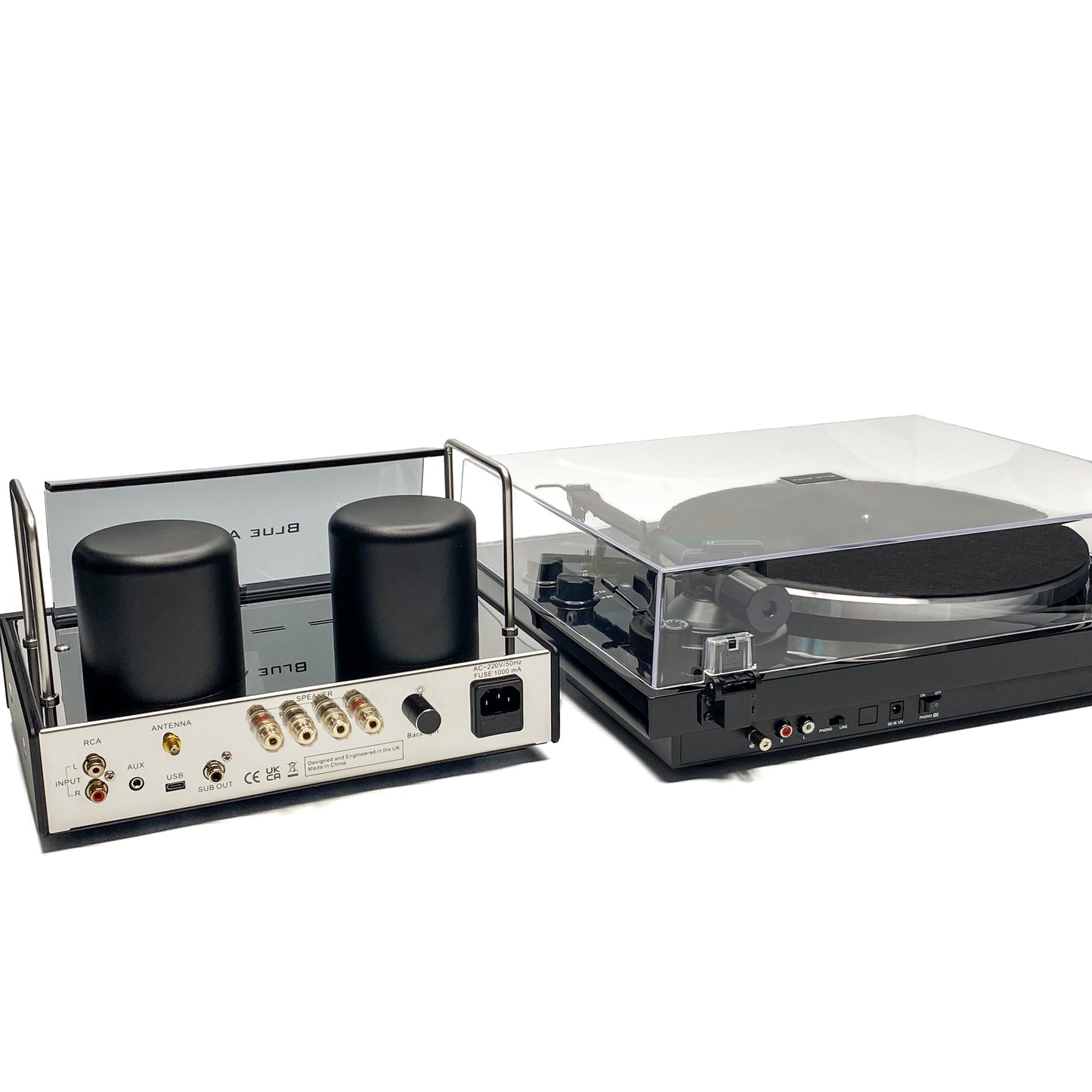 Rear high-angle studio view of the Blue Aura Core System, showcasing the complete back panel connections of the v50 hybrid amplifier and Blackline PG2 turntable with its clear dust cover closed.