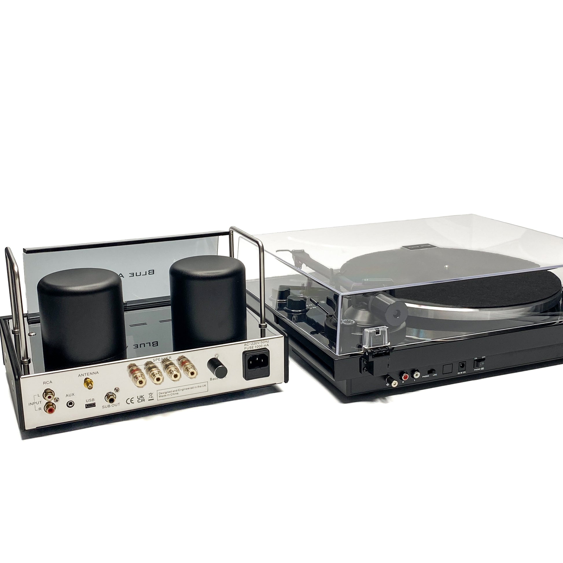 Rear high-angle studio view of the Blue Aura Core System, showcasing the complete back panel connections of the v50 hybrid amplifier and Blackline PG2 turntable with its clear dust cover closed.