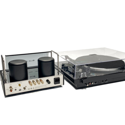 Rear high-angle studio view of the Blue Aura Core System, showcasing the complete back panel connections of the v50 hybrid amplifier and Blackline PG2 turntable with its clear dust cover closed.