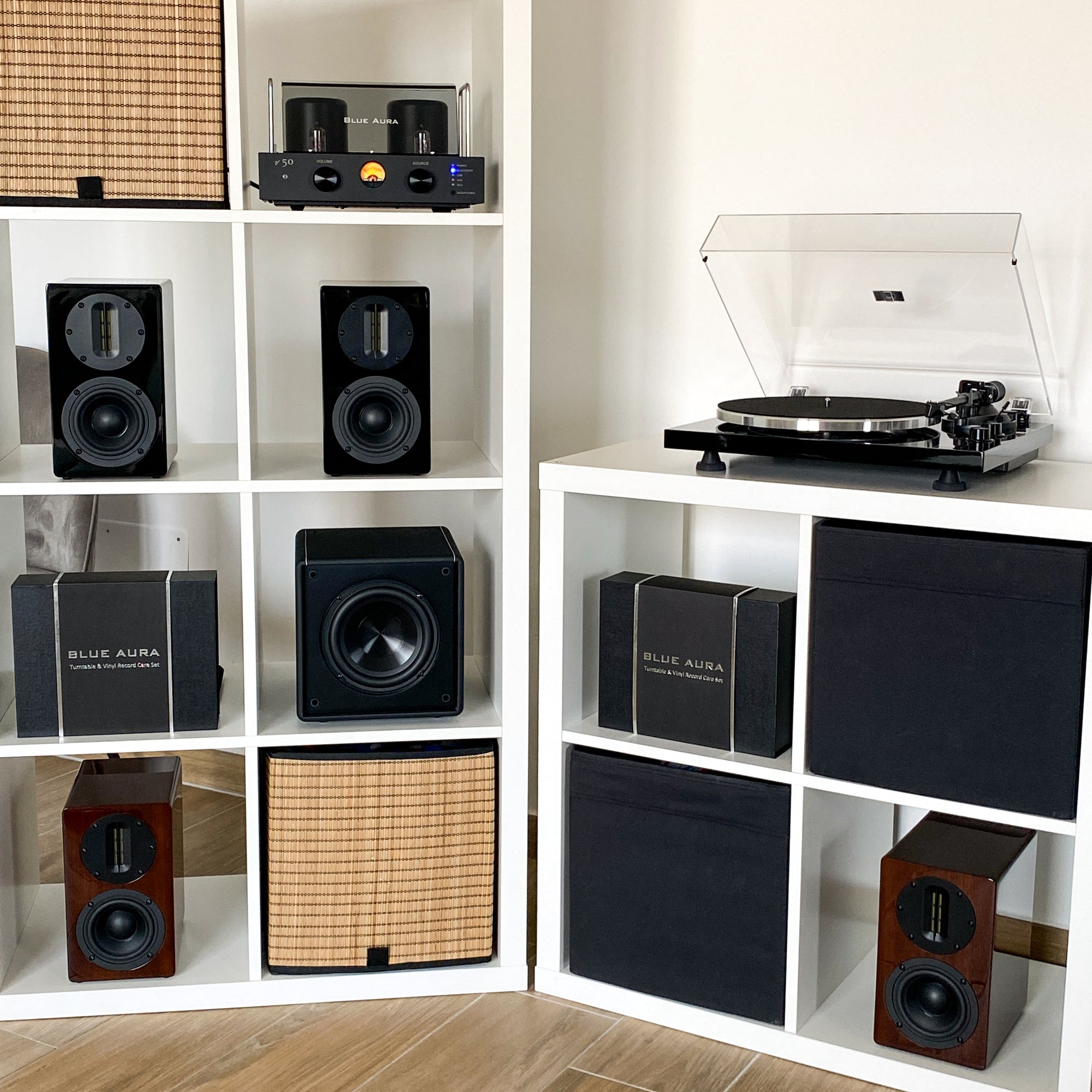 Full display of the Blue Aura Hi-Fi product range arranged inside white bookshelf units.