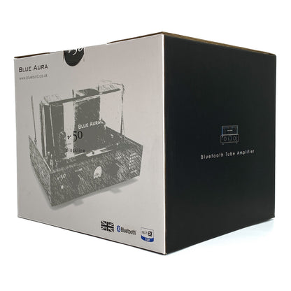 Three-quarter studio view of the official Blue Aura v50 retail packaging box, highlighting the black side panel with the Bluetooth Tube Amplifier text and logo.