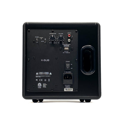 Straight rear studio view of the Blue Aura X-Sub active subwoofer, showcasing its backplate amplifier with crossover dials, volume control, phase switch, and RCA line inputs.