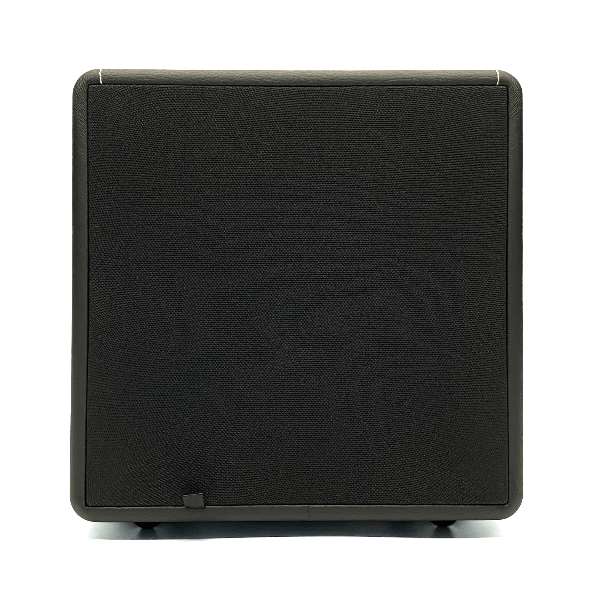 Front studio view of the Blue Aura X-Sub active subwoofer with its fabric grille on a white background.